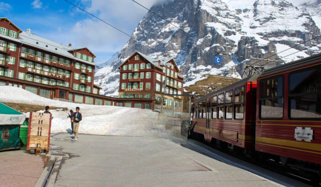 Switzerland travel cost guide 2026 featuring scenic alpine train and mountain landscape