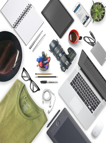 Modern workspace with laptop, camera, and smart gadgets for AI-powered travel planning.