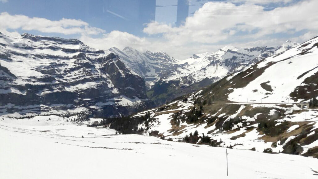 switzerland train travel guide 2026- panoramic view from large window.