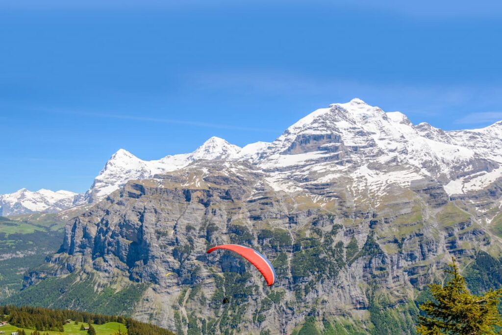 Interlaken Travel Guide: Best Things to Do & Travel Tips 4 Paragliding over Interlaken Switzerland Alps
